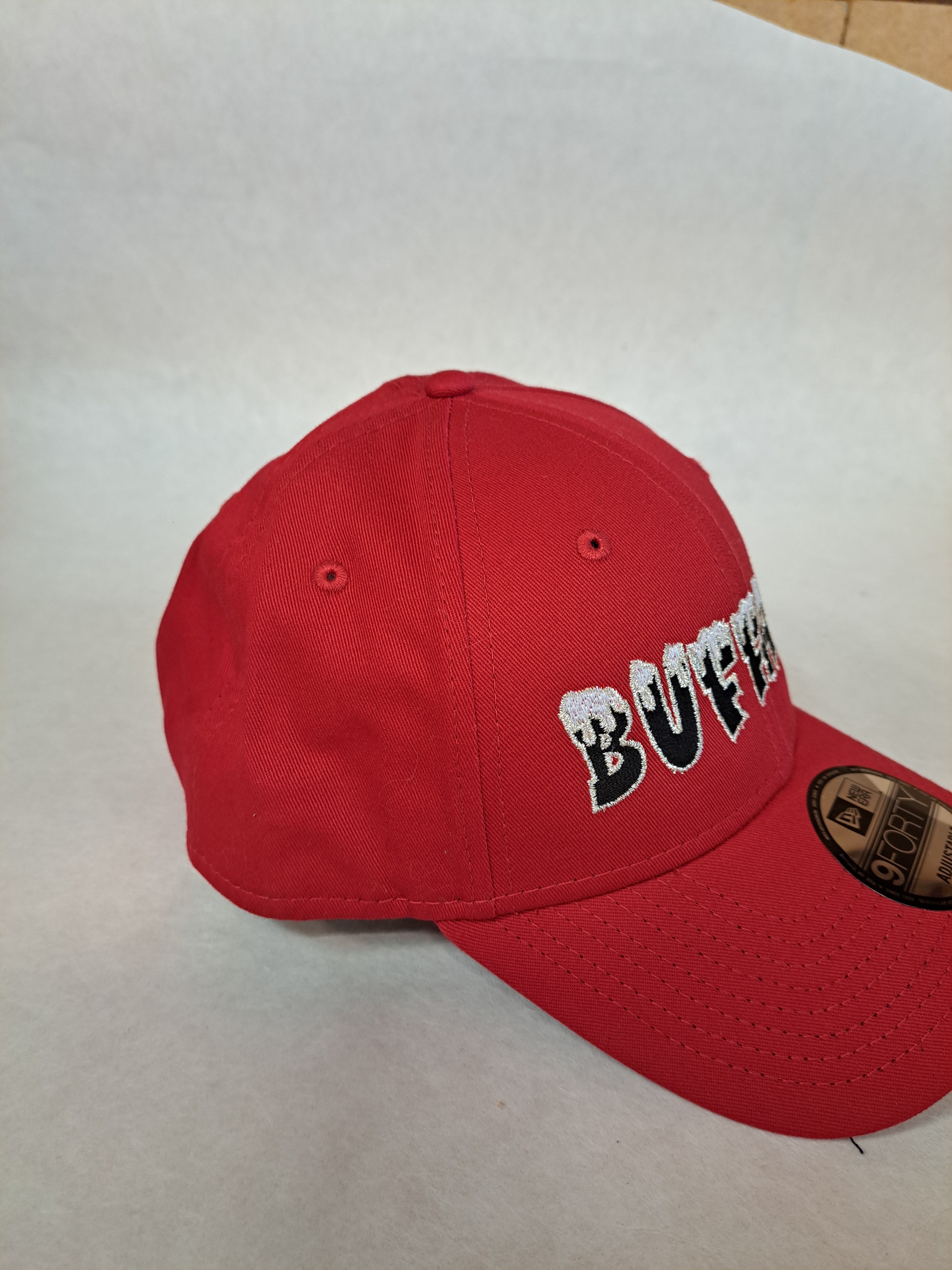 Snow on the Buffalo with metallic border on the letters, on Red New Era hat