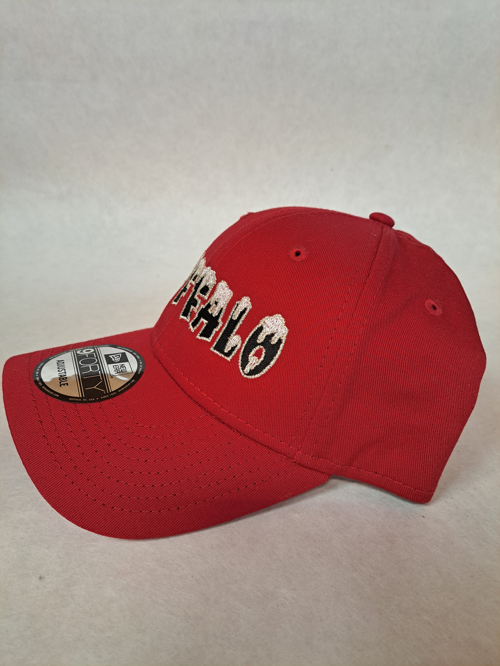 Snow on the Buffalo with metallic border on the letters, on Red New Era hat