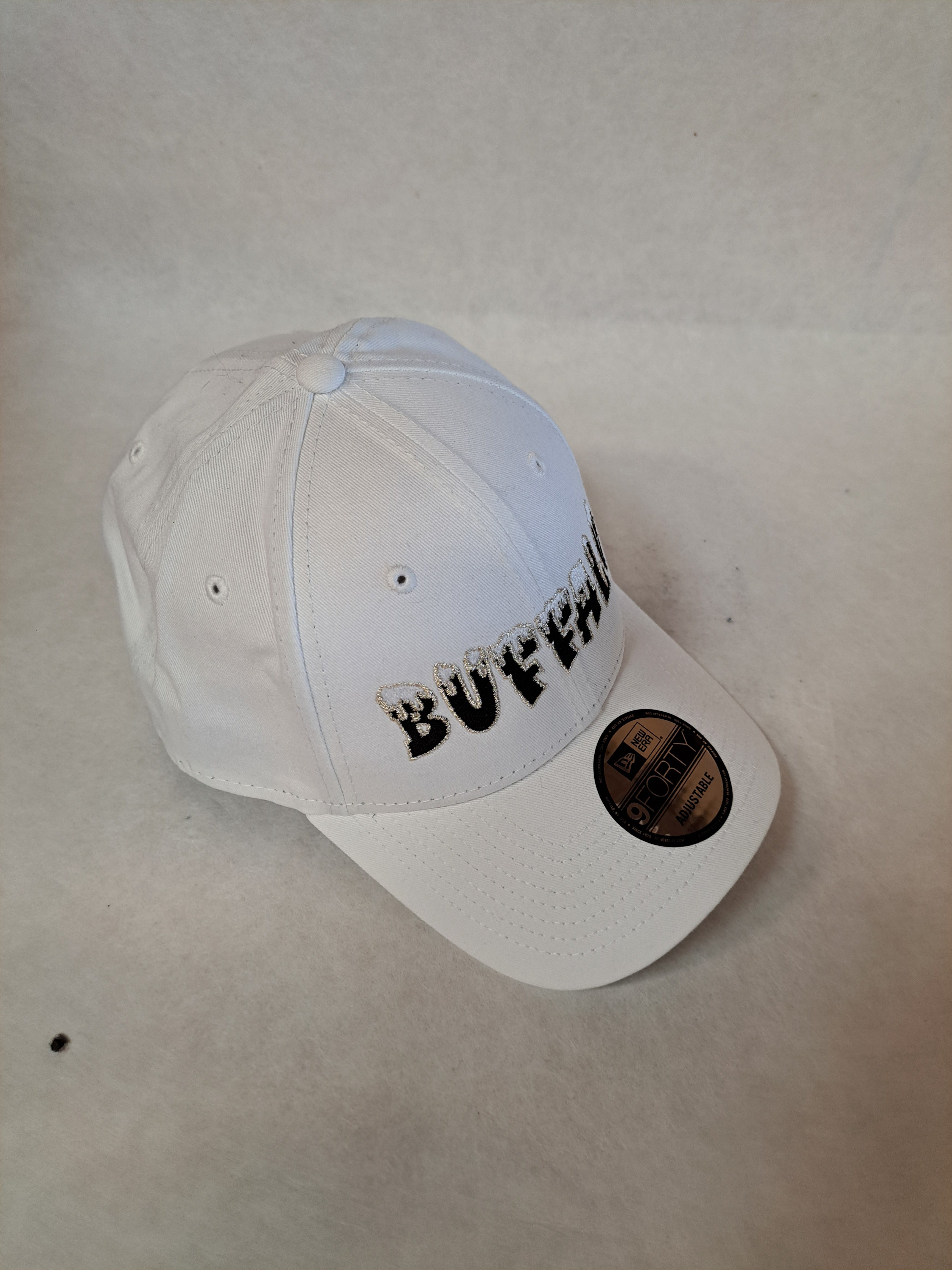 Snow Topped Buffalo Logo Black lettering on a white 9Forty New Era hat